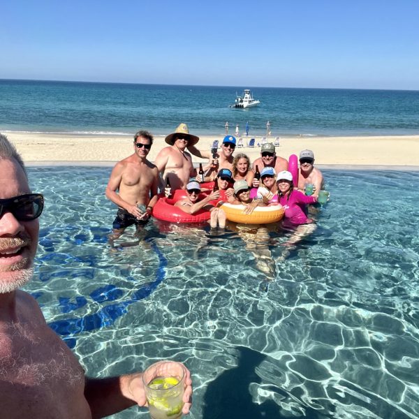 Hacienda Soñadora swimming pool with group of people swimming